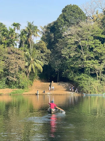 Man on canoe in India