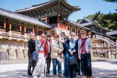 Visitors standing in front of a traditional Korean temple in Gyeongju