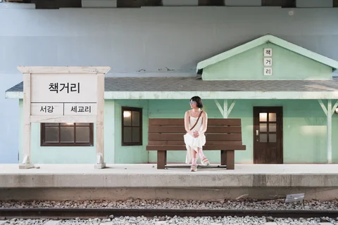 Tourist waiting at a colourful train station in South Korea