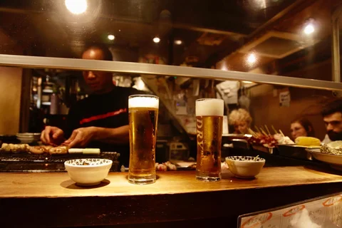 Japan beer at a bar with noodles