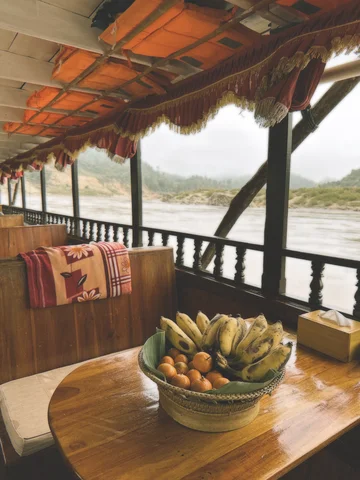 The inside of a longtail boat as it cruises along the Mekong river