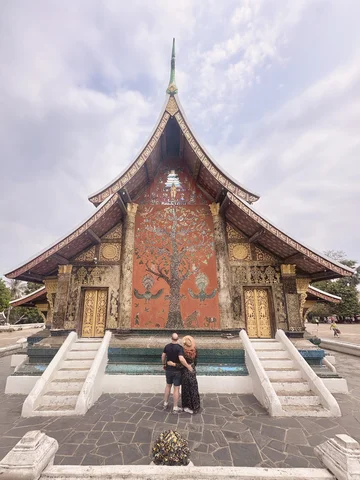 Couple outside temple in Luang Prabang