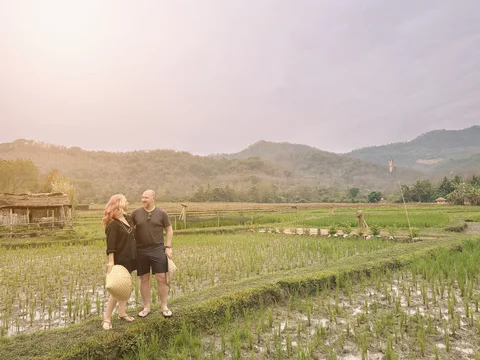 Couple at Laos buffalo dairy farm