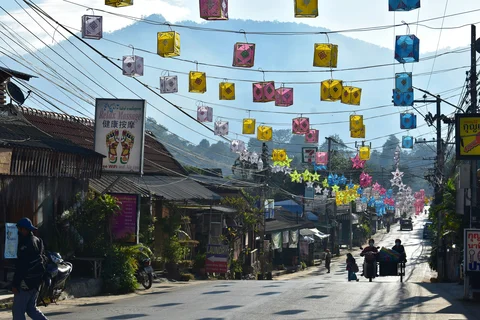 Streets of Pai decorated with lanterns strung over the road