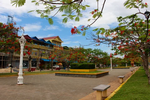 Colourful shophouses line a quiet road