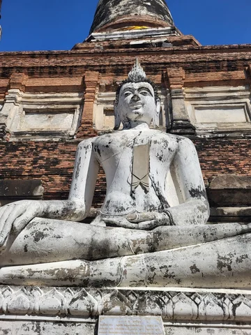 A large white sitting Buddha statue