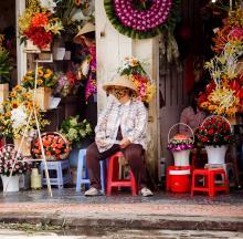 Vietnam woman at market wearing a face mask 