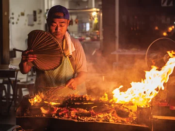 A local Malaysian flame cooking authentic Malaysian bbq street food in George Town