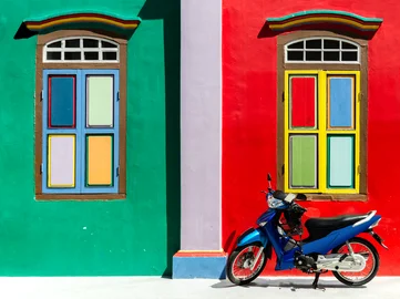 Colourful buildings and windows in Little India, Singapore with a motorbike in front