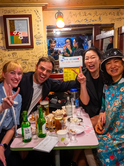 A photo of four tourists and locals from a small group tour in South Korea