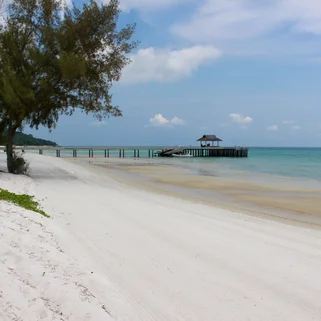 View of a quiet beach in Koh Rong with swimming platform and white sand and clear blue water