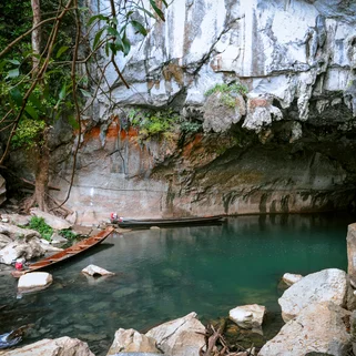 Cave entrance with two boats at Tham Kong Lor caves