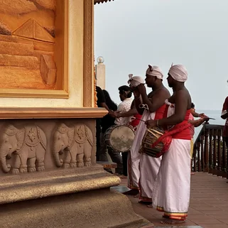 People performing a religious ritual in Matara temple