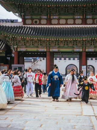 Seoul palace in November with people wearing traditional hanbok 