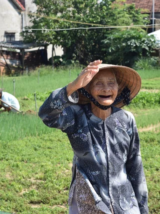 Vietnam local lady smiling friendly in Hoi An Countryside