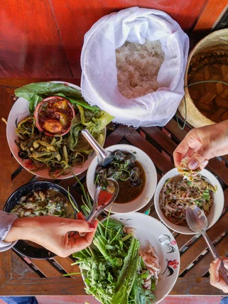 Aerial shot of diners eating traditional Thai food 