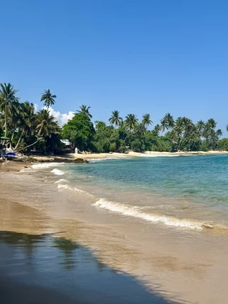 Walk across the sand in Hiriketiya low tide