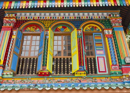 Brightly coloured Peranakan houses in Little India district of Singapore 