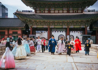 Seoul palace in November with people wearing traditional hanbok 