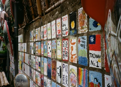Individual postcard-sized paintings on a wall