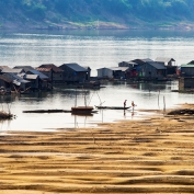 Fishing boats and traditional floating village at Kratie