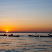 Boats on the Irrawaddy River at sunset