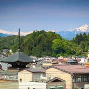 Rooftops of Takayama with snow-capped Mount Fuji in the background