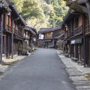 Wooden buildings lining street in Tsumago, Japan