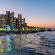 Skyline of Sokcho behind the sea at sunset