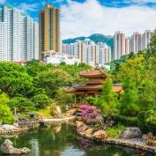 Ornate gardens with skyscrapers in the background