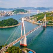 Beautiful aerial shot of Dolsan bridge in Yeosu bay, with tranquil ocean waters and green islands