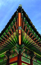Pointed edge of ornate temple rooftop