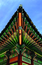 Pointed edge of ornate temple rooftop