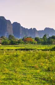 Countryside around Vang Vieng with karst mountains in the background