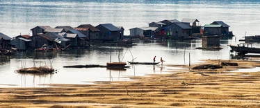 Fishing boats and traditional floating village at Kratie