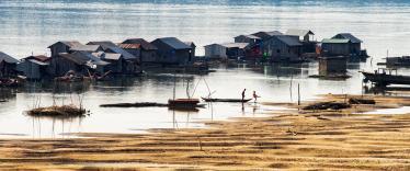 Fishing boats and traditional floating village at Kratie