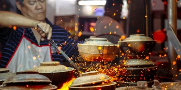 Cooking street food in Kuala Lumpur