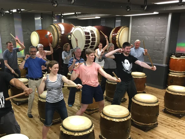 Group learning taiko drumming in Tokyo 