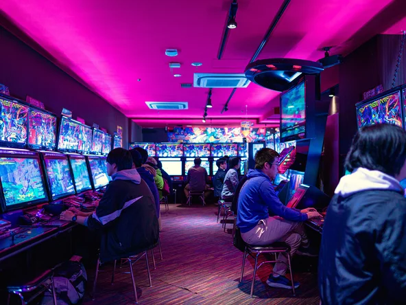 People playing video games in arcade in Tokyo 