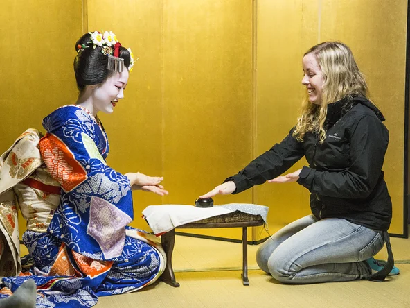Playing drinking games with a maiko in a yellow room in Kyoto 