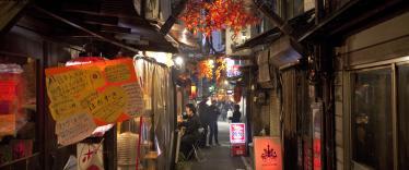 People eating in the street in autumn 