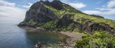 Rocky peninsula and cove on Jeju Island 