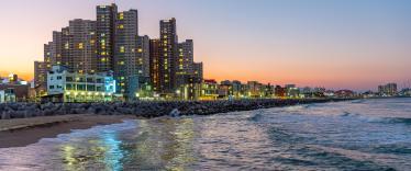 Skyline of Sokcho behind the sea at sunset