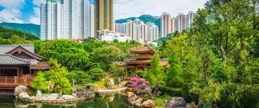 Ornate gardens with skyscrapers in the background 