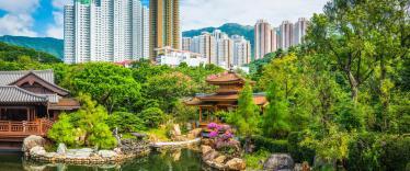 Ornate gardens with skyscrapers in the background 