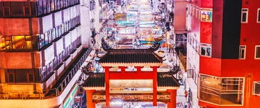 Aerial view of night market in middle of street in Hong Kong 