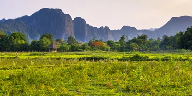 Countryside around Vang Vieng with karst mountains in the background 