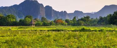 Countryside around Vang Vieng with karst mountains in the background 