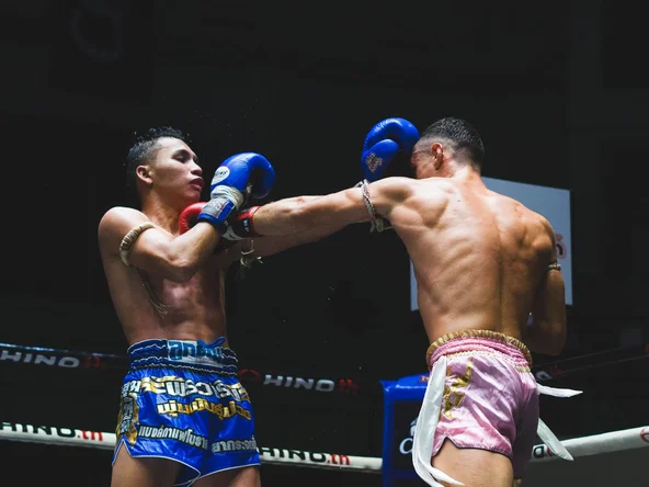 Muay Thai boxers competing in the ring in Bangkok