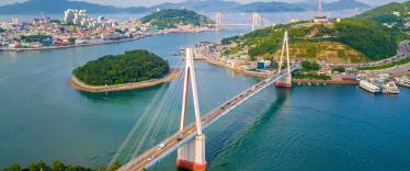 Beautiful aerial shot of Dolsan bridge in Yeosu bay, with tranquil ocean waters and green islands